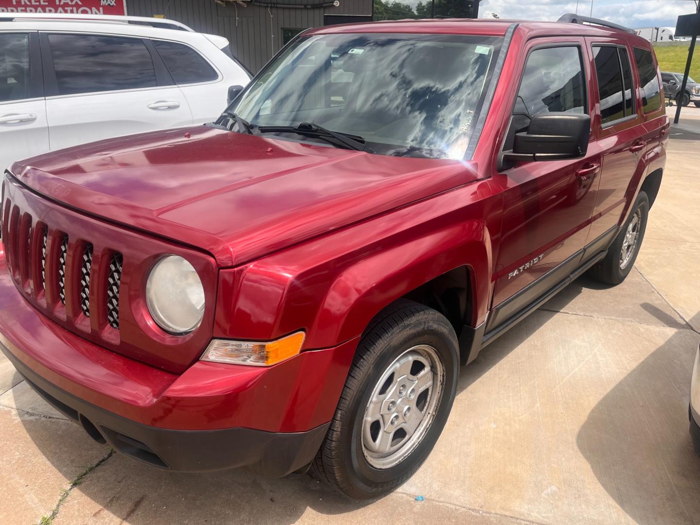 2014 RED JEEP PATRIOT SPORT Sport 4WD (1C4NJRBB9ED) with an 2.4L L4 DOHC 16V engine, located at 8101 E. Skelly Dr., Tulsa, OK, 74129, (918) 592-3593, 36.121891, -95.888802 - Photo#0